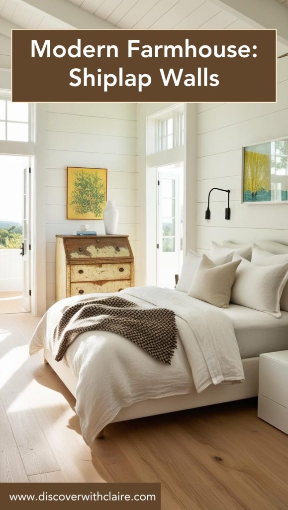 White shiplap accent wall, paired with vintage-style sconces and a rustic wooden bed frame for a farmhouse touch.